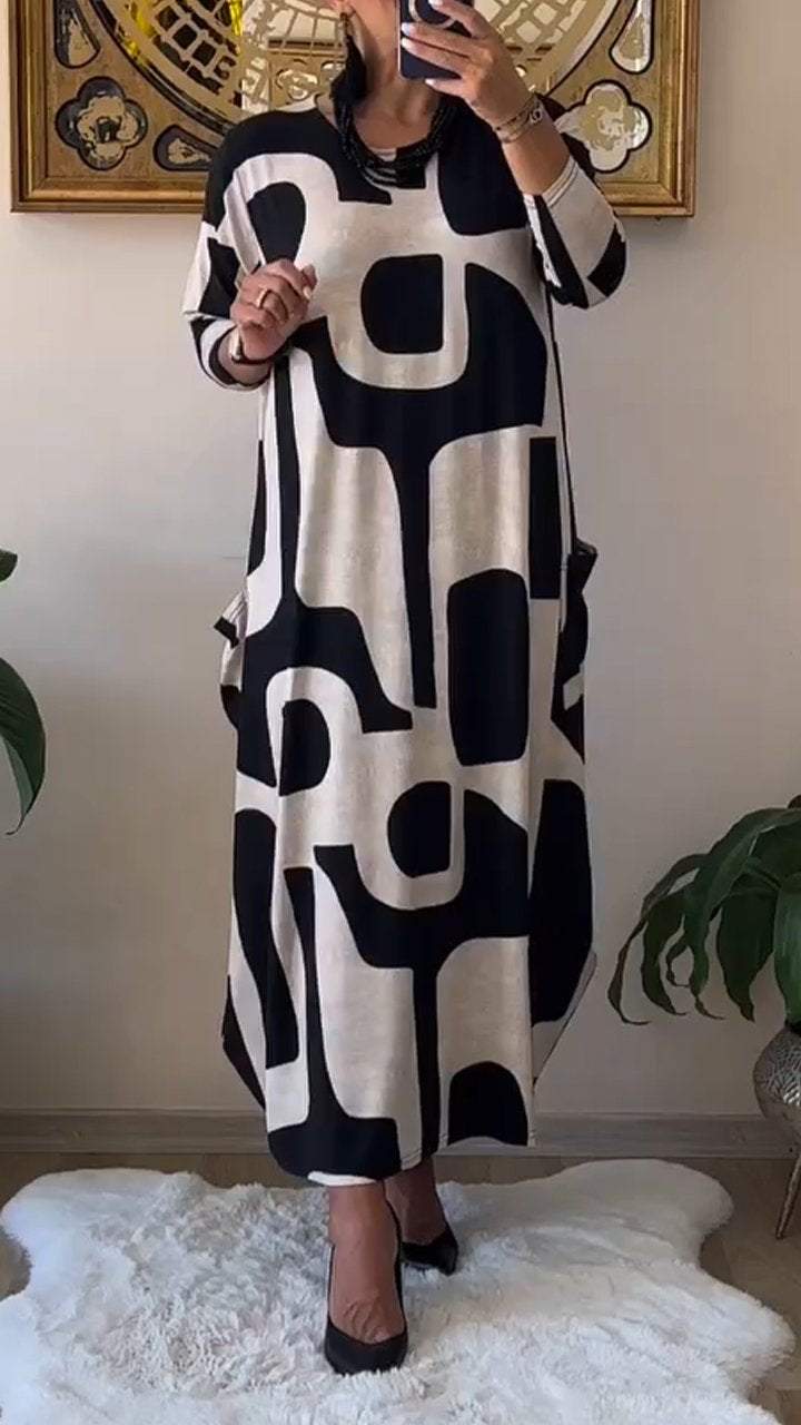 Behagelig langærmet kjole med rund hals og print